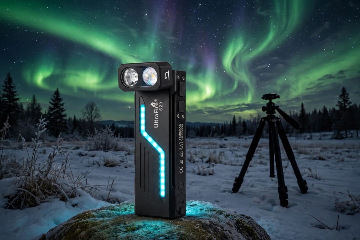 UltraFire SZ3 flashlight standing on a rock under green northern lights with a camera tripod in a snowy field at night